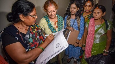 Patna: Enumerator staff collect information from residents for a caste-based census in Bihar after Patna High Court rejected a petition against the survey, in Patna. (PTI) Patna: Enumerator staff collect information from residents for a caste-based census in Bihar after Patna High Court rejected a petition against the survey, in Patna. (PTI)