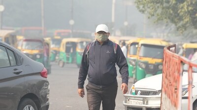 A man wears a mask to protect himself from growing level of air pollution in New Delhi on Monday. (PTI) A man wears a mask to protect himself from growing level of air pollution in New Delhi on Monday. (PTI)