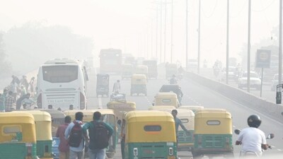 Commuters on a road amid low visibility due to smog in New Delhi. Pollution levels in Delhi-NCR on Monday morning were recorded around seven to eight times above the government-prescribed safe limit. (PTI) Commuters on a road amid low visibility due to smog in New Delhi. Pollution levels in Delhi-NCR on Monday morning were recorded around seven to eight times above the government-prescribed safe limit. (PTI)