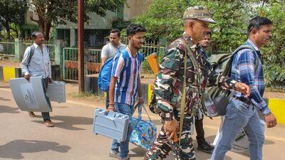 Polling officials at Jagdalpur in Chhattisgarh’s Bastar district on Monday. (PTI)
