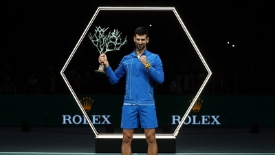 Serbia's Novak Djokovic celebrates with the trophy after winning his men's singles final match against Bulgaria's Grigor Dimitrov (REUTERS)