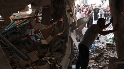 Israel-Hamas War: People inspect the rubble of a building in Rafah in the southern Gaza Strip. (AFP) Israel-Hamas War: People inspect the rubble of a building in Rafah in the southern Gaza Strip. (AFP)