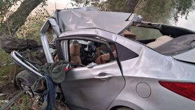 The mangled remains of the car after the collision with a truck near the Karahewala toll plaza in Moga on Monday. (HT Photo)