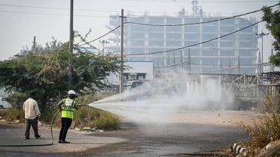 "Sprinkling water in these 13 locations will help settle down dust," he said, adding that a total of 12 fire tenders were pressed into service for the purpose which already started spraying water from Sunday. (HT Photo/Sanchit Khanna) "Sprinkling water in these 13 locations will help settle down dust," he said, adding that a total of 12 fire tenders were pressed into service for the purpose which already started spraying water from Sunday. (HT Photo/Sanchit Khanna)