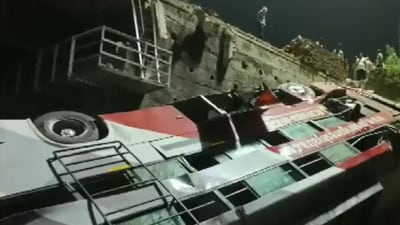 Bus fell on railway tracks. (ANI) Bus fell on railway tracks. (ANI)