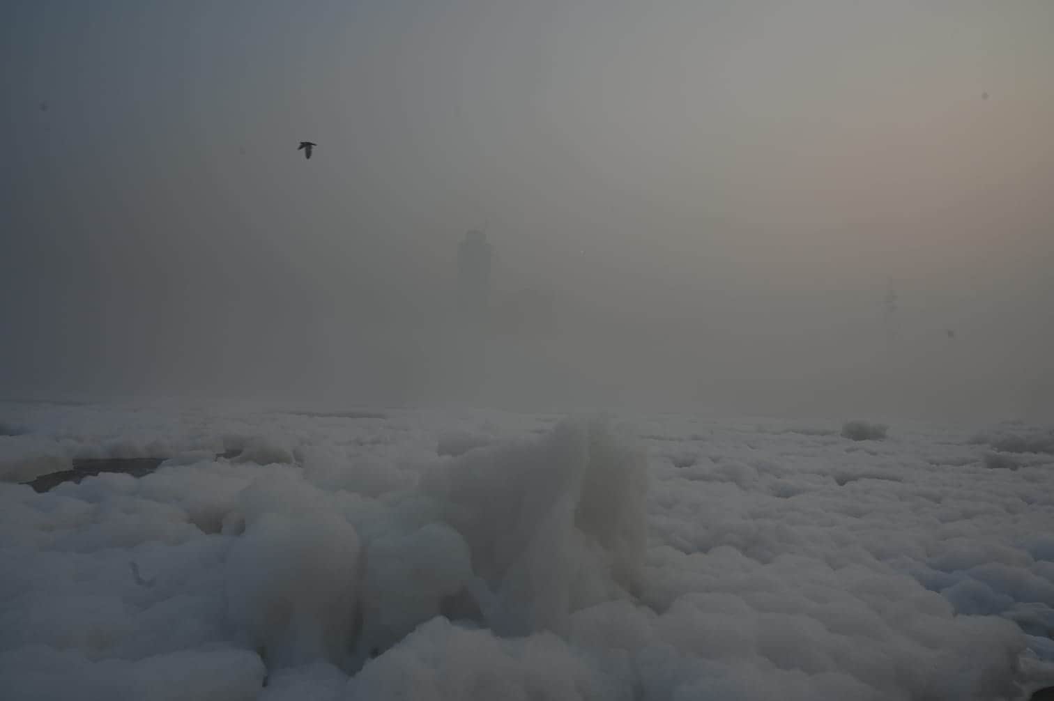 Toxic foam formed on the Yamuna River amid rising air pollution levels. The picture was taken on Monday morning near Kalindi Kunj. (Sunil Ghosh/HT Photo) Toxic foam formed on the Yamuna River amid rising air pollution levels. The picture was taken on Monday morning near Kalindi Kunj. (Sunil Ghosh/HT Photo)