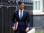 British Prime Minister Rishi Sunak walks at Downing Street in London, Britain.
