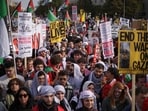 Protesters gather at the Freedom Plaza during the National March on Washington for Palestine while calling for a ceasefire between Israel and Hamas 