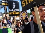 SAG-AFTRA members and supporters picket outside Paramount Studios during their strike against the Hollywood studios. SAG-AFTRA members and supporters picket outside Paramount Studios during their strike against the Hollywood studios.