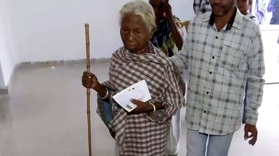 An elderly voter arrives to cast her vote for the first phase of Chhattisgarh Assembly elections in Sukma. (ANI )