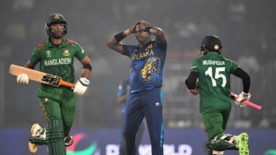 Bangladesh's Mahmudullah (L) and Mushfiqur Rahim run between the wickets as Sri Lanka's Angelo Mathews (C) watches during the 2023 ICC Men's Cricket World Cup one-day international (ODI) match (AFP)