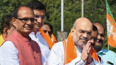 Madhya Pradesh chief minister Shivraj Singh Chouhan with Union home minister Amit Shah. (PTI) Madhya Pradesh chief minister Shivraj Singh Chouhan with Union home minister Amit Shah. (PTI)