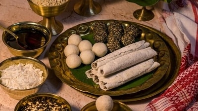 Narikol Laru (Assam): A well-loved Assamese dessert crafted primarily from coconut. It incorporates additional ingredients such as green cardamom powder, ghee, and sugar to enhance its flavor. (Pinterest) Narikol Laru (Assam): A well-loved Assamese dessert crafted primarily from coconut. It incorporates additional ingredients such as green cardamom powder, ghee, and sugar to enhance its flavor. (Pinterest)