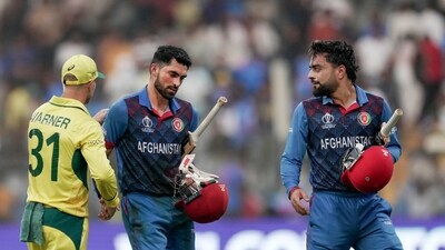 Afghanistan's Ibrahim Zadran being congratulated by Australia's David Warner (PTI) Afghanistan's Ibrahim Zadran being congratulated by Australia's David Warner (PTI)