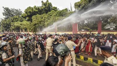 Patna: Security personnel use water cannon to disperse Anganwadi workers protesting outside the Bihar Legislative Assembly, in Patna, onTuesday (PTI) Patna: Security personnel use water cannon to disperse Anganwadi workers protesting outside the Bihar Legislative Assembly, in Patna, onTuesday (PTI)