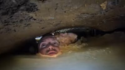 The image shows a man exploring a water-filed cave. (YouTube/@Underground_Explorers) The image shows a man exploring a water-filed cave. (YouTube/@Underground_Explorers)