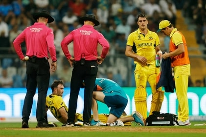 Australia's Glenn Maxwell receives medical attention after sustaining an injury (REUTERS)