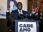 Democrat Gabe Amo gives both thumbs up to the room full of election night supporters, Tuesday, Nov. 7, 2023, at The Guild in Pawtucket, R.I., after winning Rhode Island’s 1st Congressional District seat. The former White House aide will become the state’s first Black candidate elected to the U.S. House.  (Kris Craig/Providence Journal via AP)