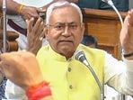 Bihar chief minister Nitish Kumar speaks amid a protest by opposition MLAs over the remarks made by him on the importance of women's education to control the population. 
