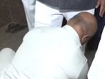 Gunman seen 'helping' Karnataka minister wear his shoes in viral video.
