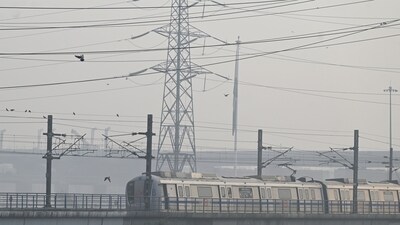 A metro train runs on a track amid dense smog (ANI) A metro train runs on a track amid dense smog (ANI)