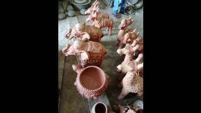 Buyers from across the country are arriving to purchase designed earthen lamps , five-faced Ganesha idols, hanging bells etc. (HT)