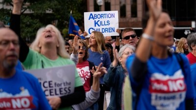 People gather and pray during the Ohio March for Life, at the Ohio State House in Columbus, Ohio, Friday, Oct. 6, 2023. As campaigning escalates in Ohio’s fall fight over abortion rights, a new line of attack from opponents suggests “partial-birth” abortions would be revived if a proposed constitutional amendment passes. (AP Photo/Carolyn Kaster) (AP) People gather and pray during the Ohio March for Life, at the Ohio State House in Columbus, Ohio, Friday, Oct. 6, 2023. As campaigning escalates in Ohio’s fall fight over abortion rights, a new line of attack from opponents suggests “partial-birth” abortions would be revived if a proposed constitutional amendment passes. (AP Photo/Carolyn Kaster) (AP)