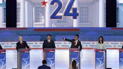 (File) Republican presidential candidates (L-R), former New Jersey Gov. Chris Christie, former U.S. Vice President Mike Pence, Florida Gov. Ron DeSantis, Vivek Ramaswamy, former U.N. Ambassador Nikki Haley, and U.S. Sen. Tim Scott (R-SC) participate in the first debate of the GOP primary season (Getty Images via AFP)
