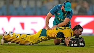 Glenn Maxwell is attended by a member of team support staff during the ICC Men's Cricket World Cup match between Australia and Afghanistan (AP) Glenn Maxwell is attended by a member of team support staff during the ICC Men's Cricket World Cup match between Australia and Afghanistan (AP)