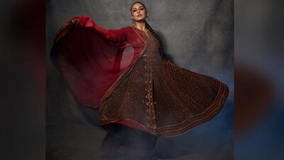 Her outfit features a black and rust kurta in rayon crepe and viscose chinon base. It has elbow-length sleeves, a scooped neckline and intricate hand embroidery all over. She teamed it with matching flared pants and a netted red dupatta. (Instagram/@iamhumaq) Her outfit features a black and rust kurta in rayon crepe and viscose chinon base. It has elbow-length sleeves, a scooped neckline and intricate hand embroidery all over. She teamed it with matching flared pants and a netted red dupatta. (Instagram/@iamhumaq)