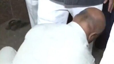Gunman seen 'helping' Karnataka minister wear his shoes in viral video. (X/BJP4Karnataka) Gunman seen 'helping' Karnataka minister wear his shoes in viral video. (X/BJP4Karnataka)