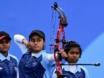 India's Parneet Kaur (C) competes in the archery compound women's team event at Aisan Games