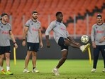 South Africa's David Miller (L), Aiden Markram (2L), Kagiso Rabada (2R) and Quinton de Kock play football during a practice session.