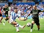 Real Sociedad's Spanish forward Carlos Fernandez vies with Girona's Dutch defender Daley Blind during a La Liga match.