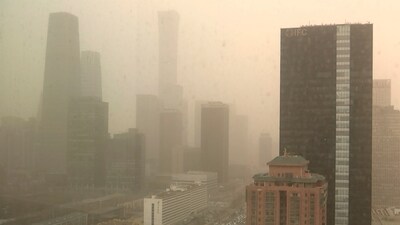 A view of the central business district shot through a glass window during a dust storm in Beijing. (Borg Wong / AP) A view of the central business district shot through a glass window during a dust storm in Beijing. (Borg Wong / AP)
