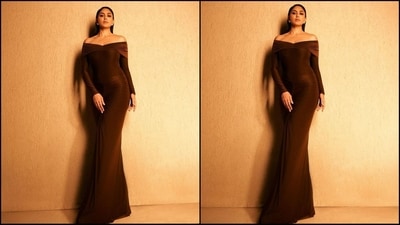Her stunning brown gown combines an off-shoulder design with full sleeves and a pleated drape at the bust, exuding elegance. The fitted waist and hips create a flattering silhouette, while gathers at the center below the waist add a touch of sophistication and style. (Instagram/@mrunalthakur) Her stunning brown gown combines an off-shoulder design with full sleeves and a pleated drape at the bust, exuding elegance. The fitted waist and hips create a flattering silhouette, while gathers at the center below the waist add a touch of sophistication and style. (Instagram/@mrunalthakur)