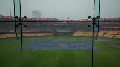 The pitch is covered during rain ahead of the ICC Men's Cricket World Cup 2023 match between New Zealand and Sri Lanka at M. Chinnaswamy Stadium, in Bengaluru, Tuesday, Nov. 7, 2023. (PTI) The pitch is covered during rain ahead of the ICC Men's Cricket World Cup 2023 match between New Zealand and Sri Lanka at M. Chinnaswamy Stadium, in Bengaluru, Tuesday, Nov. 7, 2023. (PTI)