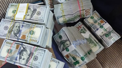 Photocopied counterfeits of Dollars were found in the garbage pile. (HT File image) Photocopied counterfeits of Dollars were found in the garbage pile. (HT File image)