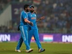 India's Jasprit Bumrah, left, celebrates with teammate Mohammed Shami as they leave the field after India win their ICC Men's Cricket World Cup match against England. India's Jasprit Bumrah, left, celebrates with teammate Mohammed Shami as they leave the field after India win their ICC Men's Cricket World Cup match against England.