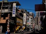 People commute on their motorbikes in the morning in New Taipei City, Taiwan November 9, 2023.