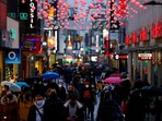 Shoppers walk down Hohe Strasse shopping district in Germany. Shoppers walk down Hohe Strasse shopping district in Germany.