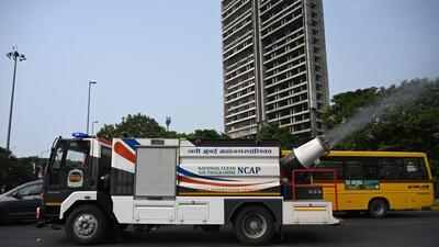 An anti smog gun under the National clean air programme sprays water to control dust to prevent air pollution on Plam Beach road at Sanpada in Navi Mumbai, India, on Wednesday, November 8, 2023. (Bachchan Kumar/ HT PHOTO)