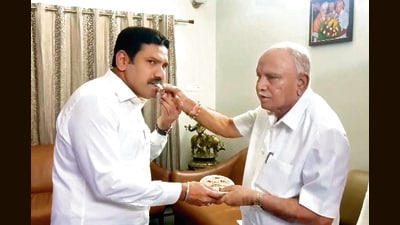 Former Karnataka CM and BJP leader BS Yediyurappa congratulates son BY Vijayendra Yediyurappa after he was appointed as the party president for Karnataka, in Bengaluru on Friday. (ANI) Former Karnataka CM and BJP leader BS Yediyurappa congratulates son BY Vijayendra Yediyurappa after he was appointed as the party president for Karnataka, in Bengaluru on Friday. (ANI)