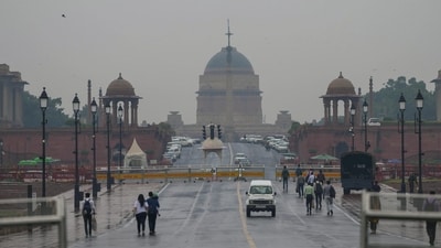 New Delhi: People move on the Kartavya Path after overnight rain, in New Delhi, (PTI)