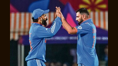 Virat Kohli and Mohammed Shami celebrate the wicket of New Zealand's Mitchell Santner during the ICC Men's World Cup ODI cricket match between India and New Zealand at the HPCA Stadium, Dharamshala on October 22, 2023. (Manvender Vashist Lav/PTI) Virat Kohli and Mohammed Shami celebrate the wicket of New Zealand's Mitchell Santner during the ICC Men's World Cup ODI cricket match between India and New Zealand at the HPCA Stadium, Dharamshala on October 22, 2023. (Manvender Vashist Lav/PTI)