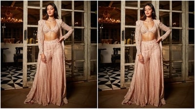 Her outfit consists of a deep V-neck bralette top, flared embellished trousers and a long gold embroidered jacket with full sleeves. (Instagram/@tanghavri) Her outfit consists of a deep V-neck bralette top, flared embellished trousers and a long gold embroidered jacket with full sleeves. (Instagram/@tanghavri)
