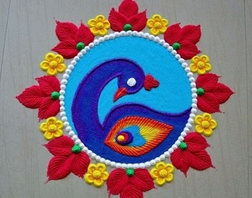 Celebrate the beauty of nature with a peacock-inspired Rangoli. (Pinterest) Celebrate the beauty of nature with a peacock-inspired Rangoli. (Pinterest)
