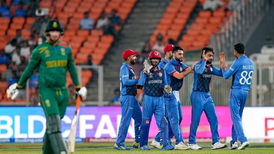 Ahmedabad: Afghanistan's Rashid Khan and other players celebrate the wicket of South African batter Heinrich Klaasen during the ICC Men's Cricket World Cup 2023 match between Afghanistan and South Africa, at Narendra Modi Stadium, in Ahmedabad, Friday, Nov. 10, 2023. (PTI Photo/Arun Sharma) (PTI11_10_2023_000348A)(PTI)
