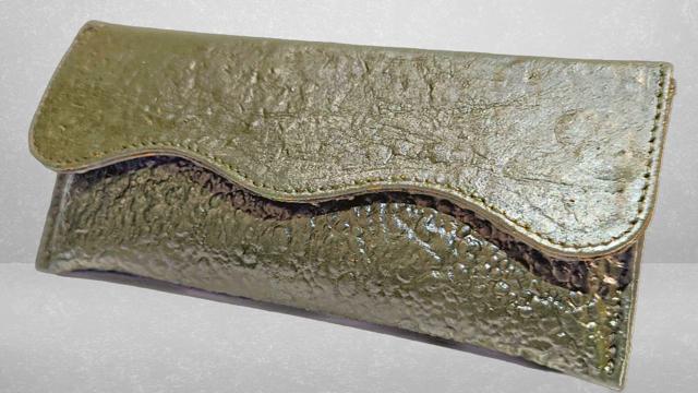 A clutch by India-based Phool, which is breaking down discarded flowers to make a leather alternative called Fleather. (Phool)