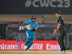 Virat Kohli (L) and Trent Boult during India's match against New Zealand during 2023 World Cup's group stage